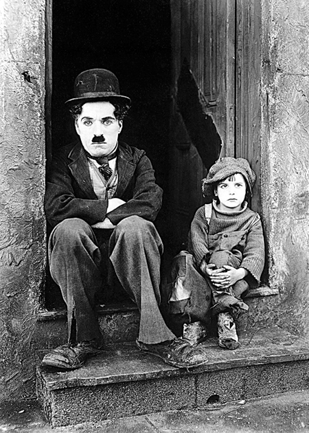 Charlie Chaplin and Jackie Coogan in The Kid 1921